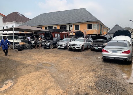 Mercedes-Benz cars being serviced in the Moses Benz Auto Care yard, Idimu